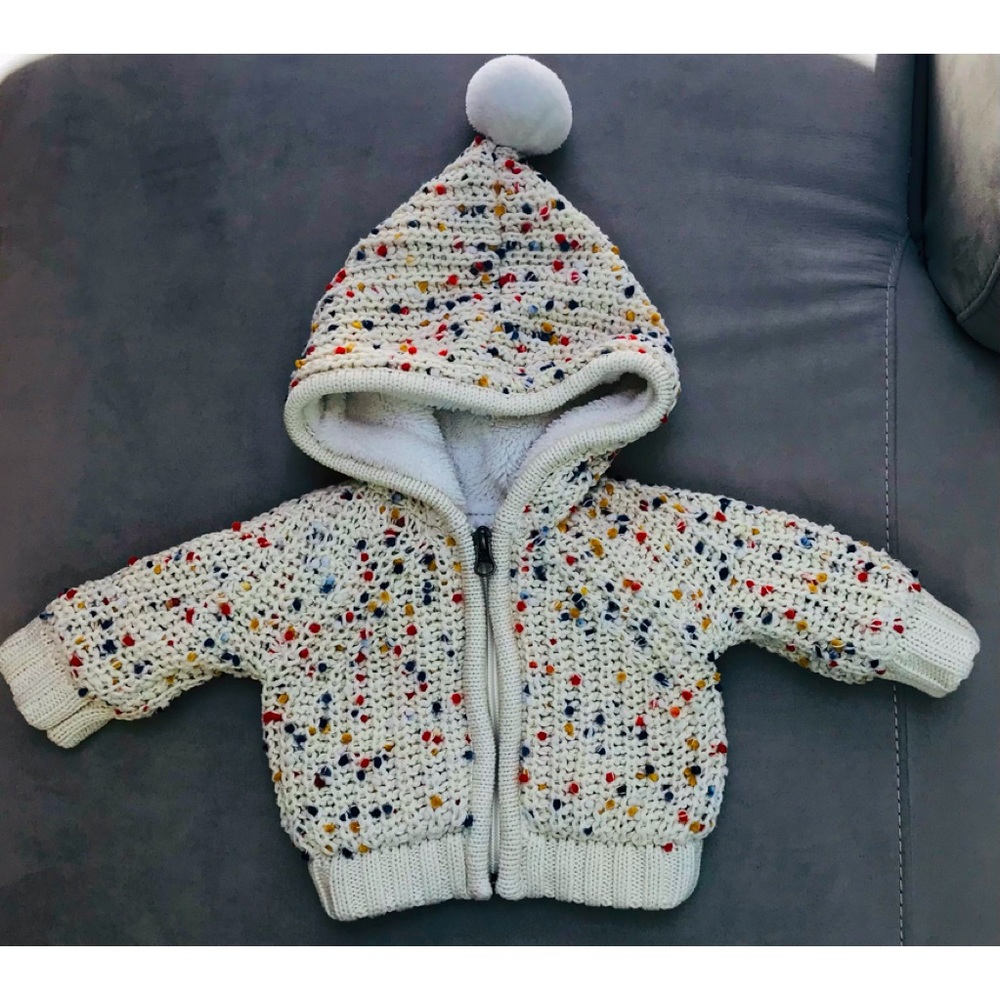 NWOT. Hanna Anderson Soft knit hoodie with zip front. Lined with fleece. 0-3M